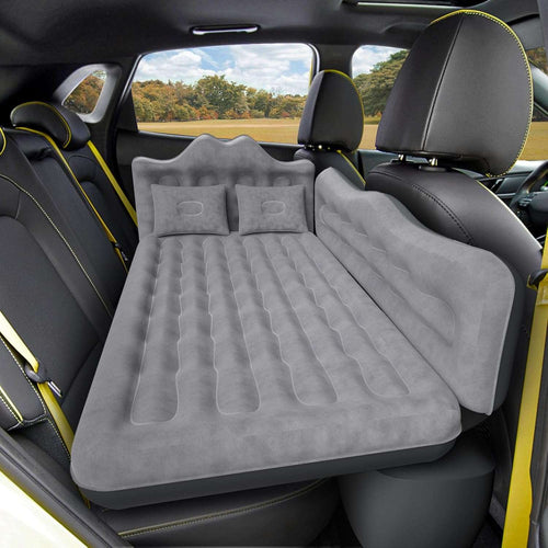 Inflatable car mattress installed in a vehicle with a scenic background