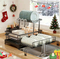 Kitchen dish rack with dishes in a decorated kitchen during Christmas.