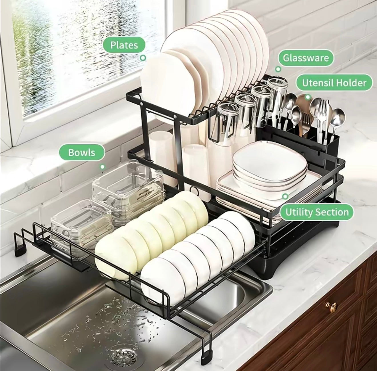 Kitchen dish rack with labeled sections on a countertop next to a sink.