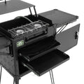 Black camping stove with multiple compartments on a white background
