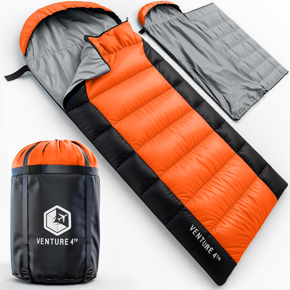Orange and black sleeping bag with compression sack on a white background