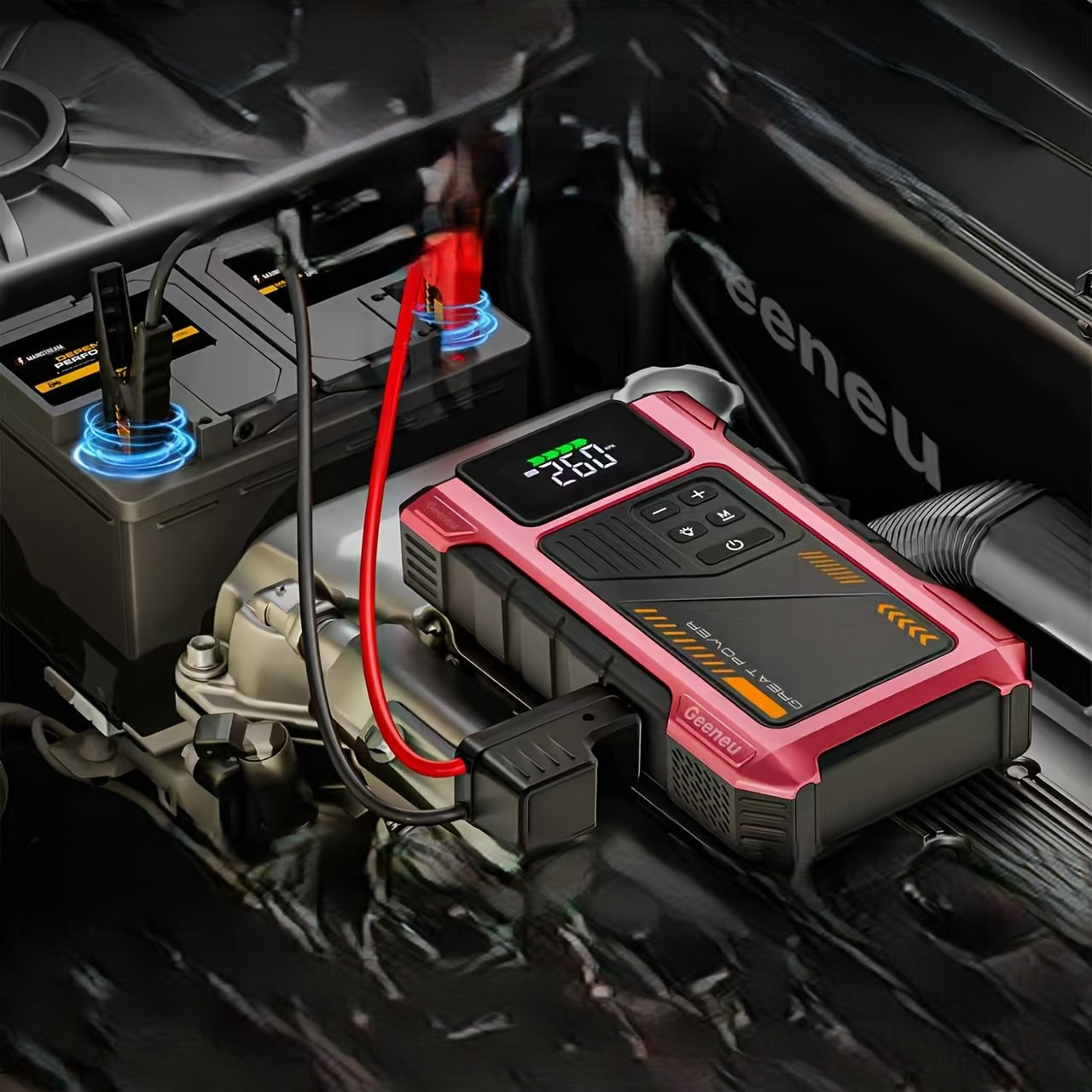 A portable car battery jump starter and charger with a pink and black rugged design, connected to a car battery under the hood of a vehicle.