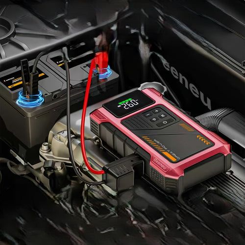 A portable car battery jump starter and charger with a pink and black rugged design, connected to a car battery under the hood of a vehicle.