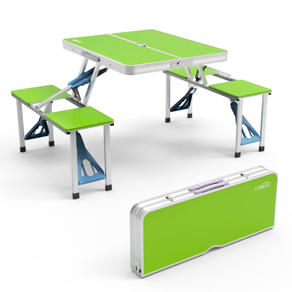 Foldable picnic table with green top and benches on a white background
