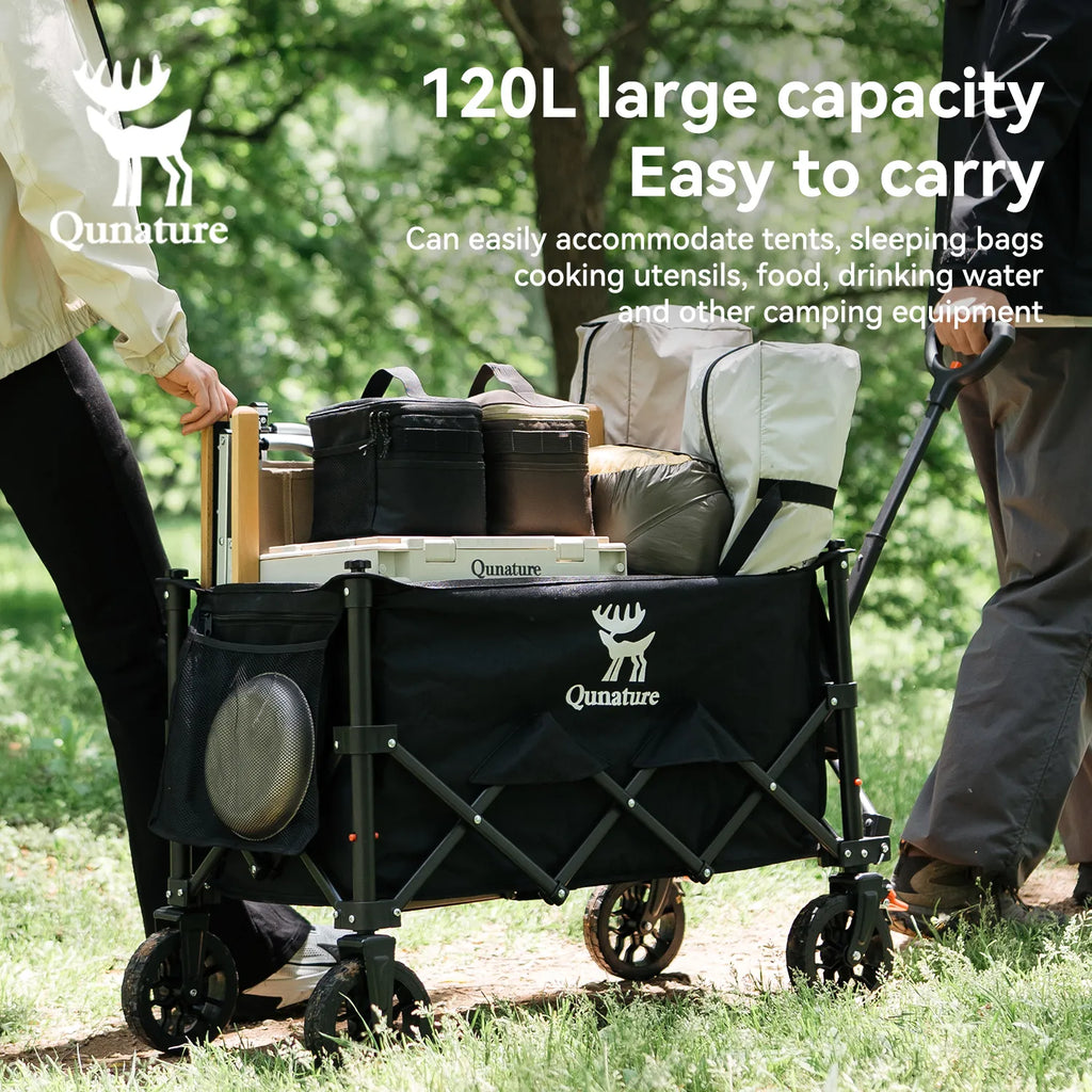 Black camping wagon with Qunature branding, being pulled through a park.