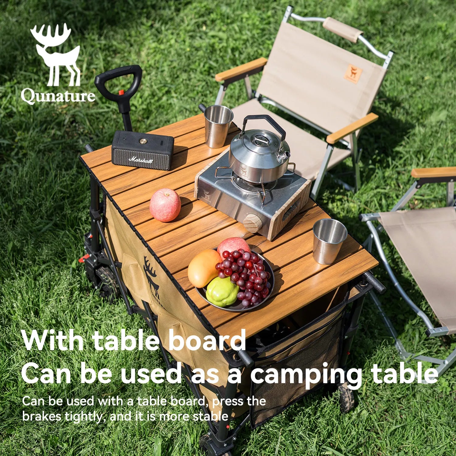 Camping chair with a wooden table on grass, featuring a kettle and fruits, with Qunature branding.
